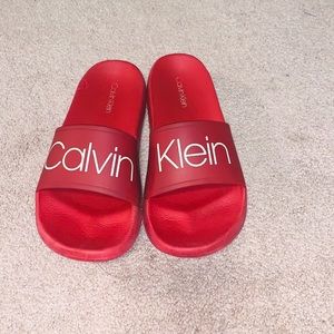 Red Calvin Klein slides